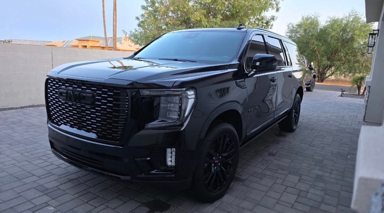 Freshly detailed black GMC Denali with a mirror-like finish in Chandler, Arizona